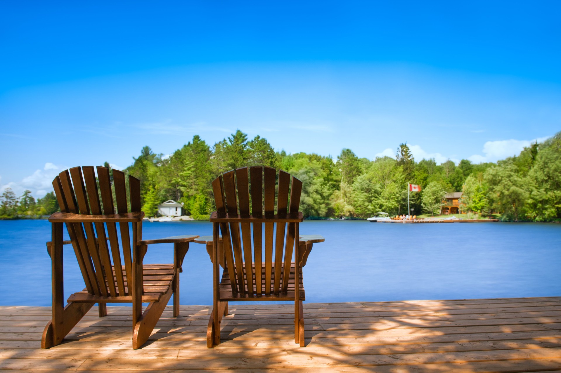 Brown Adirondack chairs on dock